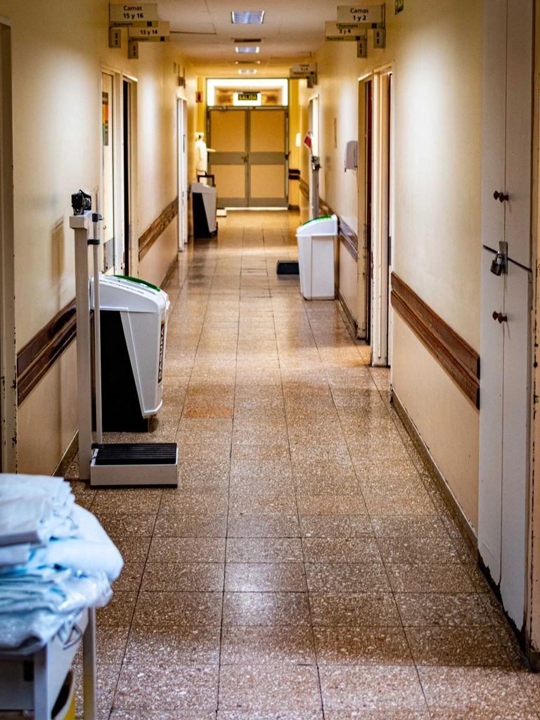 Hospital corridor finished with WallProtect sheet wall covering and matching corner guard.