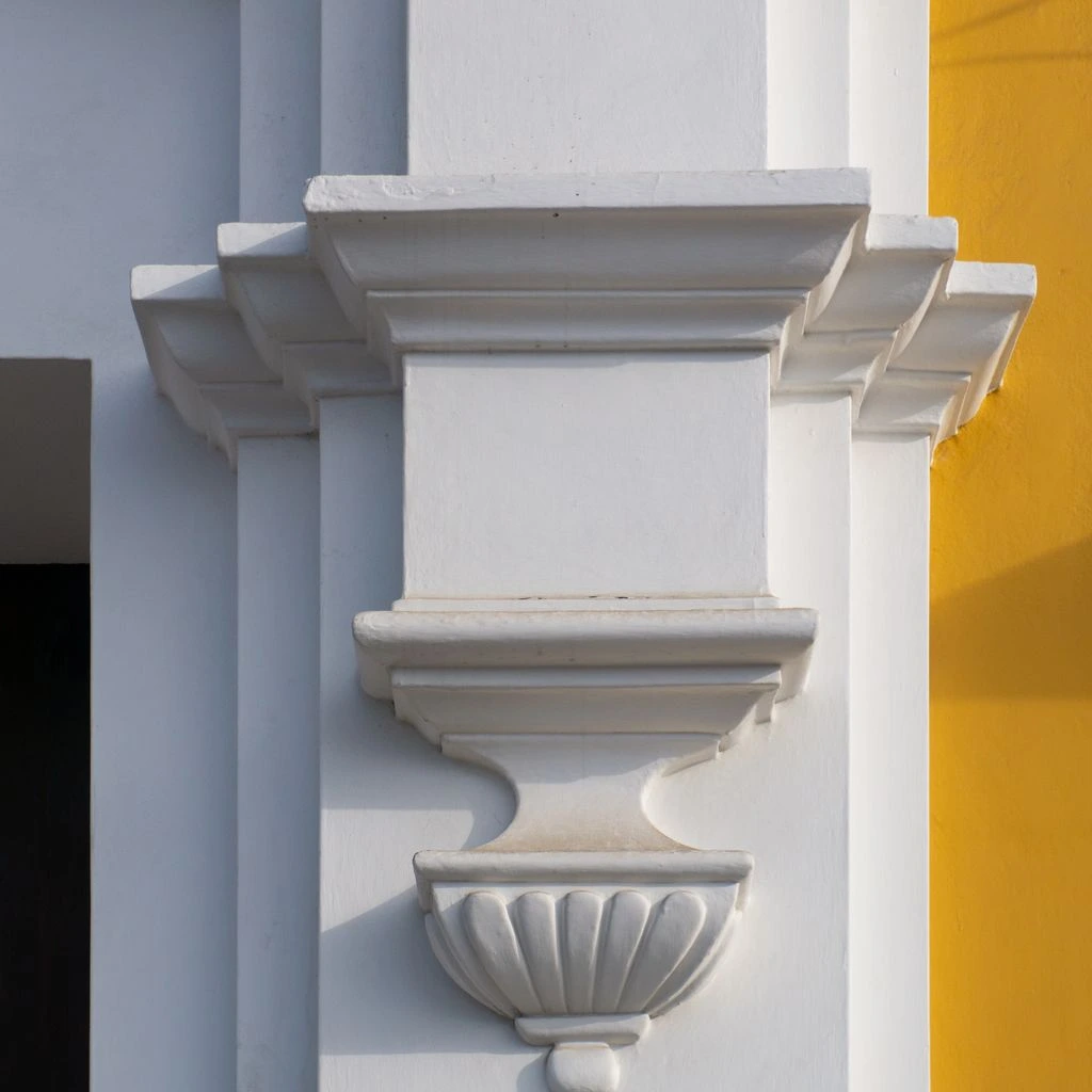 Bone WCV‑04 wall covering paired with aluminum corner guard.
